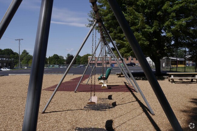 A row of swings at Highland Elementary School.