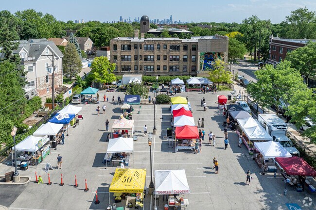 Views of downtown Chicago in the distance as the crowd files into the Lincoln Square market.