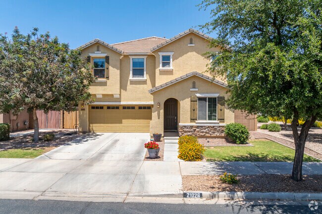Residents of The Villages at Queen Creek enjoy homes featuring clay tile roofs and arched entryways, embodying the timeless appeal of Southwestern architecture.