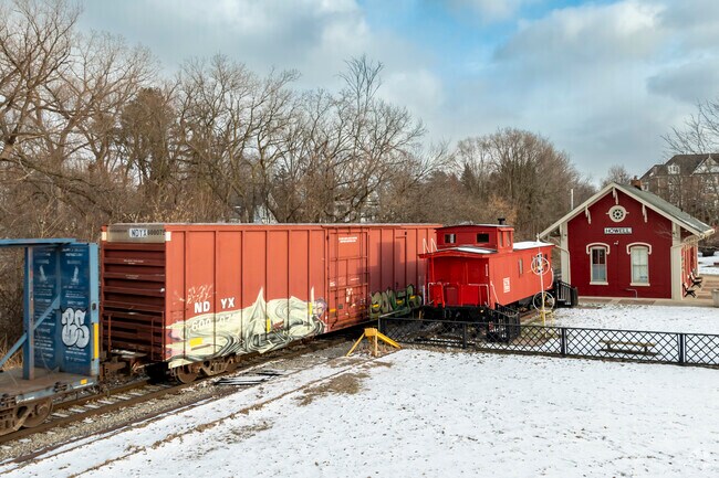 Trains roll past the Howell Depot Museum in downtown Howell.