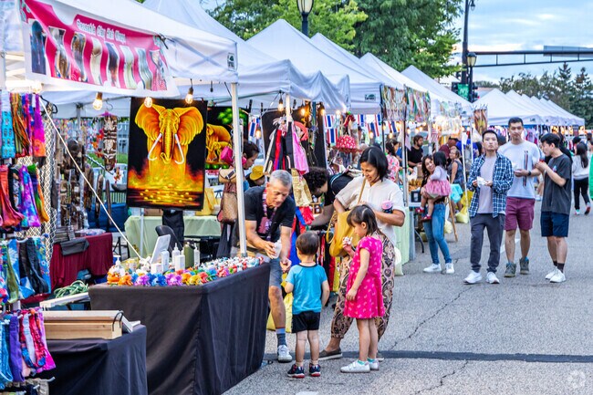 Vendors offer goods at the MinnesoThai Street Food Festival.