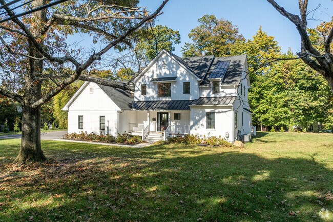 This modern, contemporary home sits on a large lot very close to downtown West Chester.