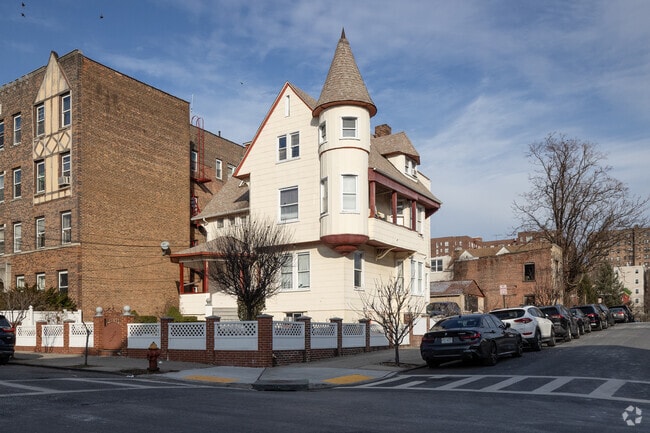 A detached multistory colonial house features classical design that enhances its look.