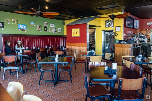 Customers enjoy an afternoon eating at the colorful Tin Roof Grill.