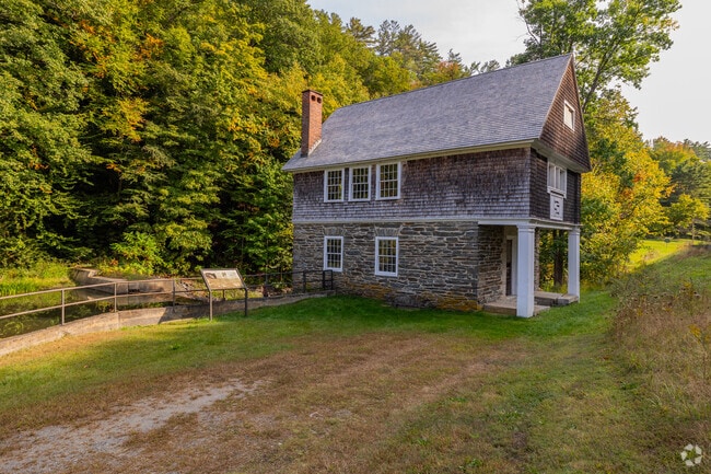 Explore the charm of an old historic mill building in Cornish, showcasing a rich history.