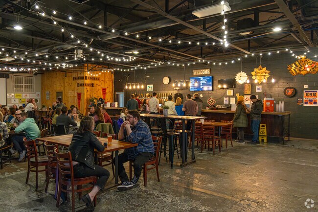 Peabody Heights Brewery offers plenty of seating, arcades, drinks, and foods.