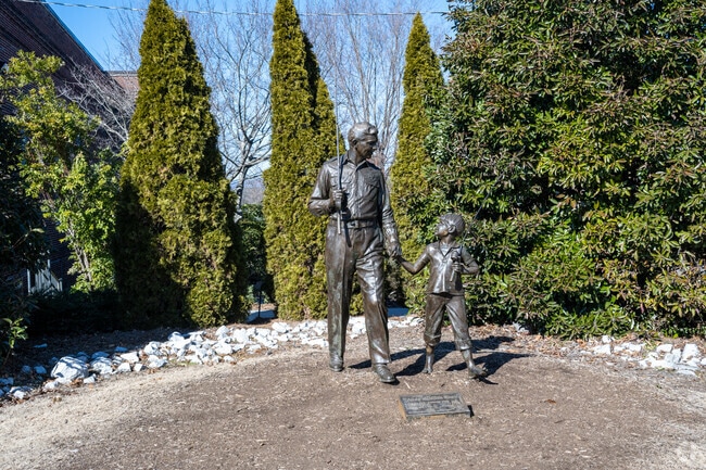 Residents and visitors alike enjoy viewing and taking pictures with the classic statue of Andy Griffith and Opie at the museum in Mount Airy.