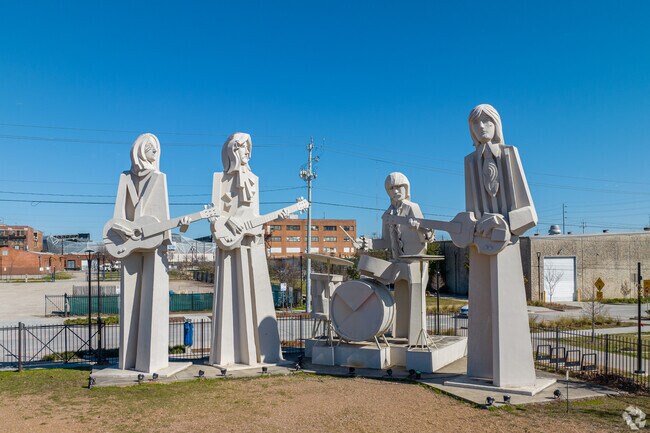 The Beatles statue in East Downtown shows off the neighborhood's quirky rock spirit.