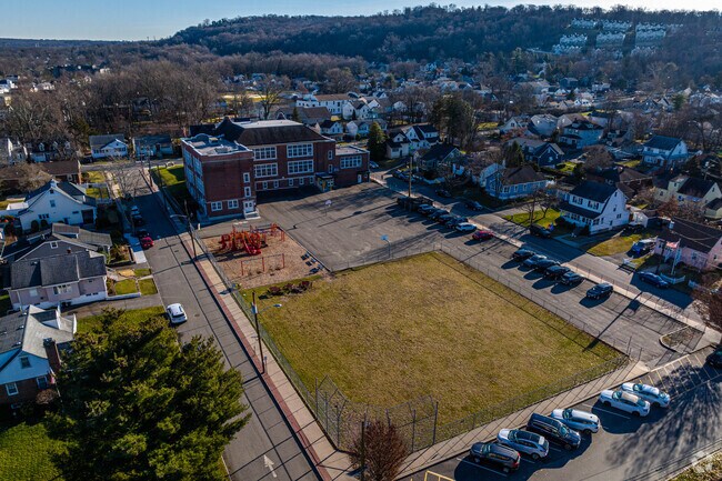 Little Falls School No. 3 has a large playground and green area for students.