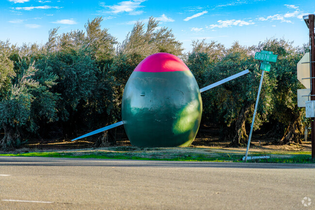 A large 15 foot green olive pays homage to Cornings roots.