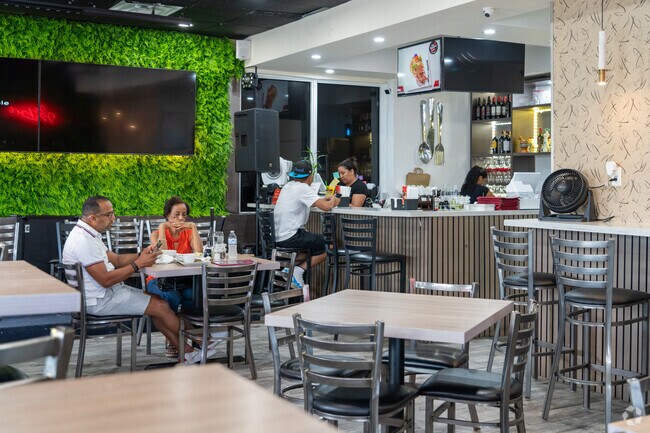 Taste the Dominican flavors at Con Hambre in Lawn Acres, a culinary gem in the area.