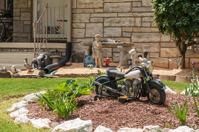 Curb appeal is important to most Elmwood homeowners with lawn ornamentation ranging from traditional to quirky.