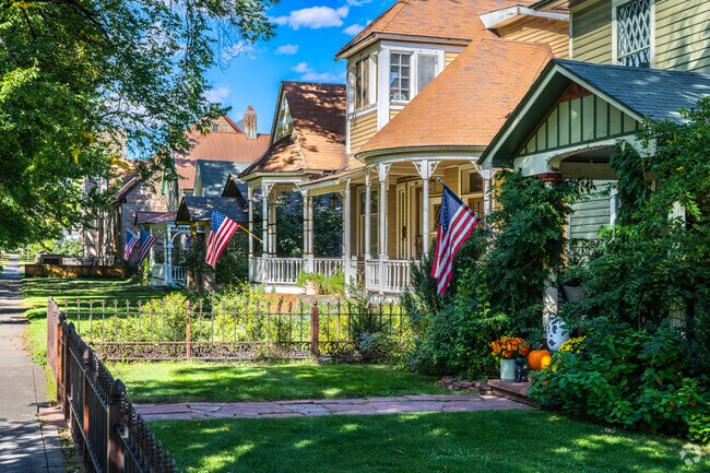 American flags fly outside of beautifully renovated Victorian homes in The Grid.