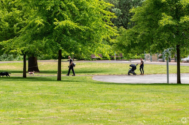 Residents of West Minnehaha enjoy the paved paths and play structures at Leverich Park.
