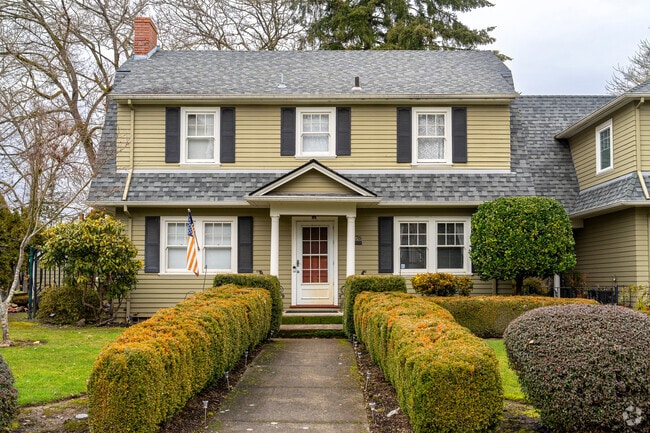 You'll find a variety of early 20th century and mid-century homes surrounding downtown Cornelius, like this quintessential Colonial Revival home.