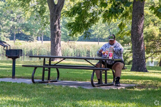 Picnic tables at Benson Park offer a quiet lunch spot near Orchard Park.