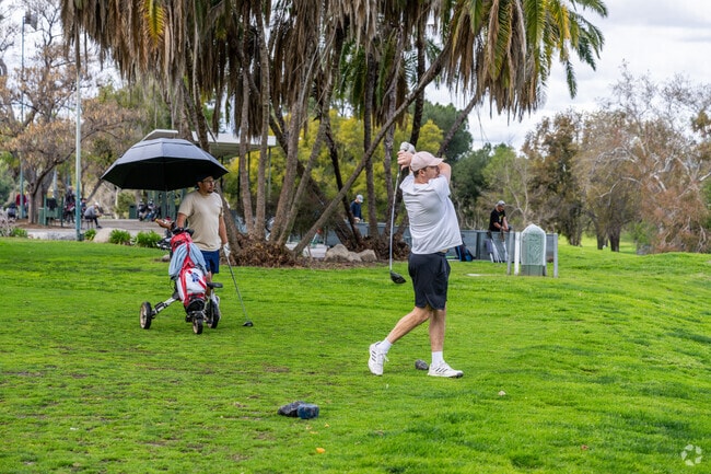 A golfer hits the ball at the Hansen Dam Golf Course near Shadow Hills.