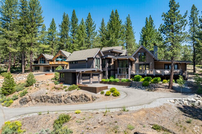Elegant mountain estates in Prosser Lake Heights offer lodge-style features and forest views.