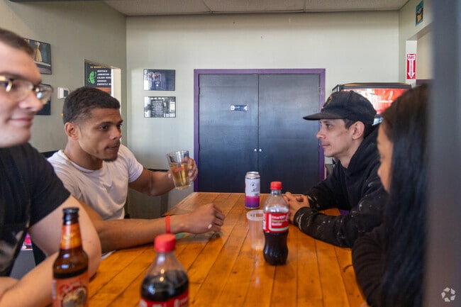 Friends gather at Po' Boys and Pickles near North Deering.