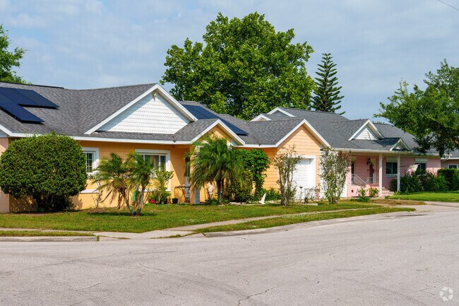 Southport homes boast pastel exteriors in shades of pink, green, and blue.