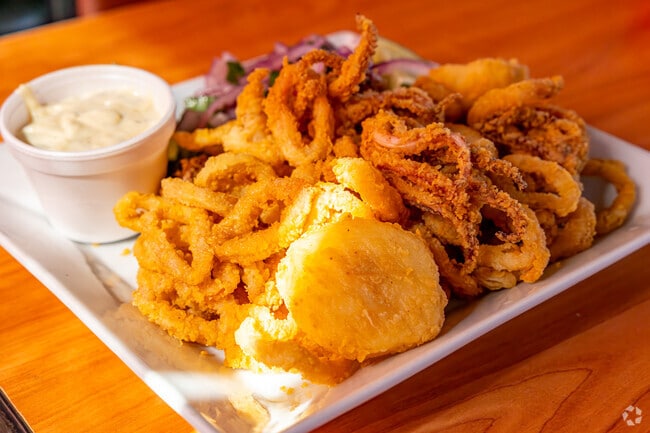 Try the delicious squid plate from El Pollo Imperial in the neighborhood of DeForest Park.