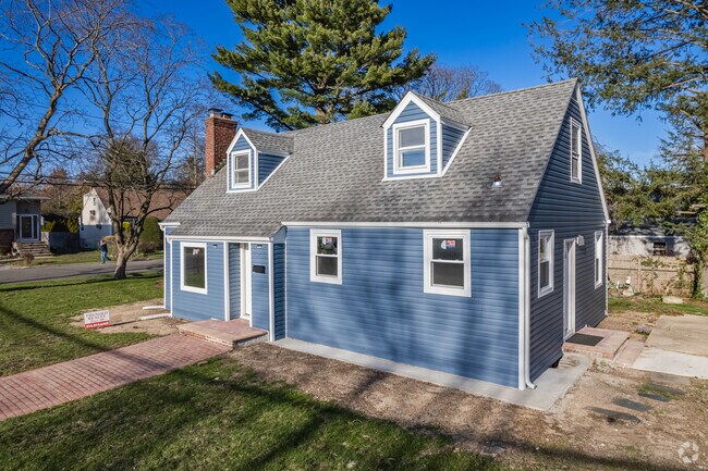 Here is a freshly remodeled Cape Cod in Huntington Station.