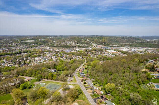 Carnegie neighborhood homes stretch down the hill to the charming business district.