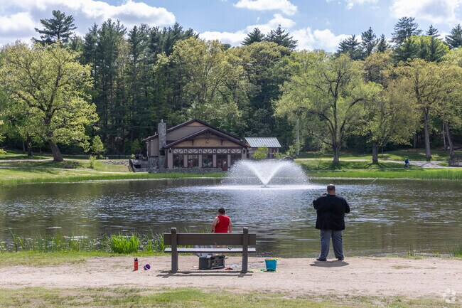 A father and son enjoy some quality time fishing at the pond at White Park in North Concord.