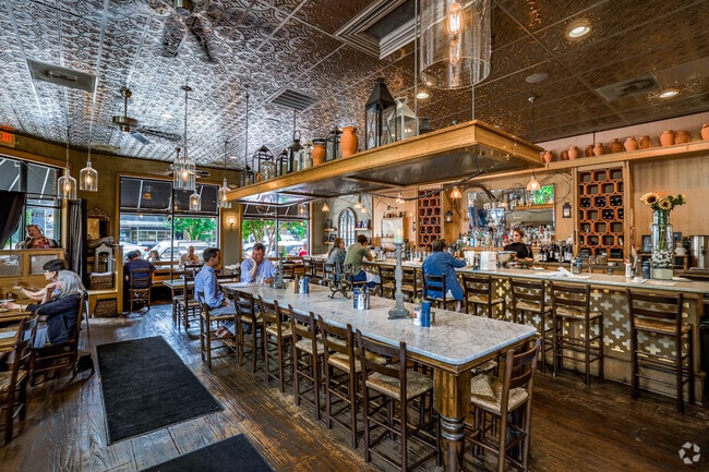 Stella’s restaurant interior has a warm comfortably casual feel located in Colonial Place.