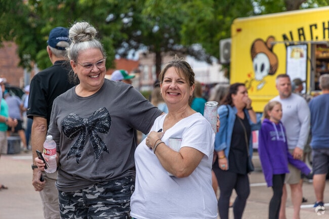 Families and friends gather together to celebrate at the 8th Street Dance event.