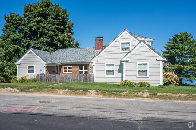 A one story Craftsman style home sits on Mattanawcook Pond.
