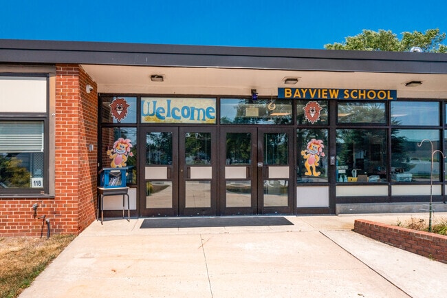 Bayview Elementary School main entrance is filled with hand painted welcome signs.