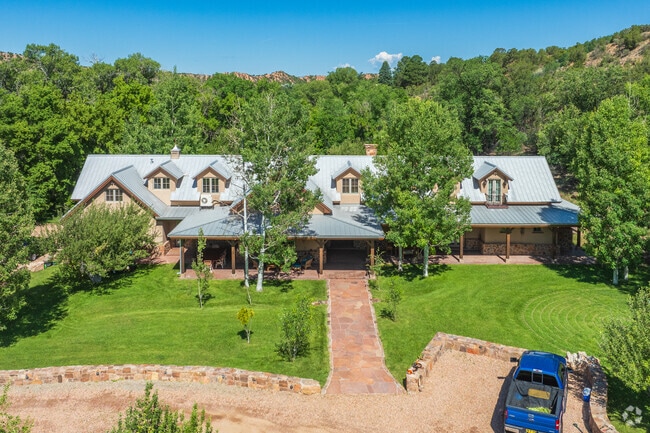 Large homes with beautiful green yards can be found all over Tesuque.