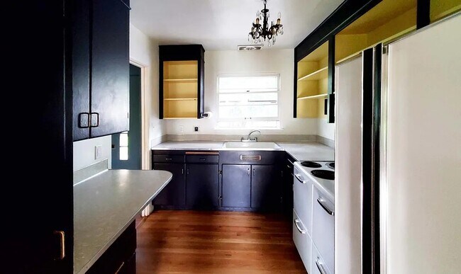 Kitchen with open shelves and pantry