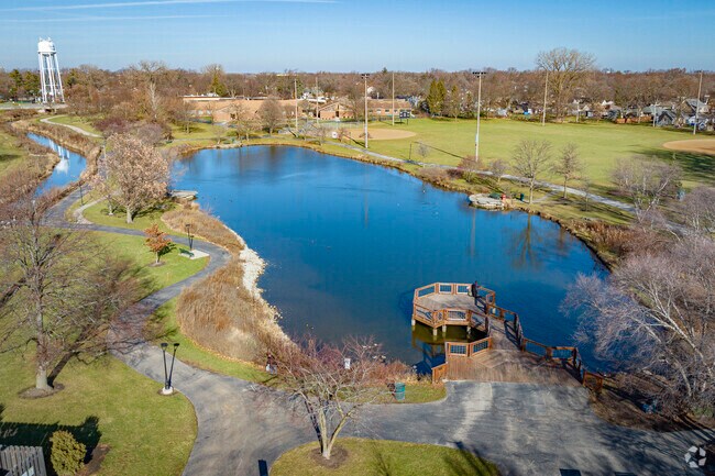 A Rolling Meadow's local utilizes Kimball Hill Park's pond for a pleasant fishing experience.