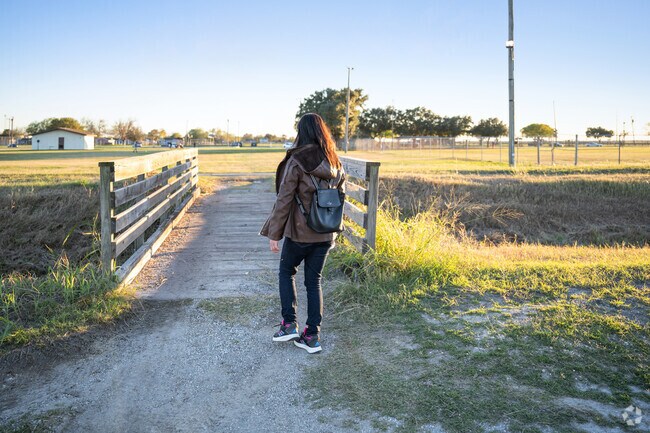This young woman enjoys a walk across a bridge in Robstown.