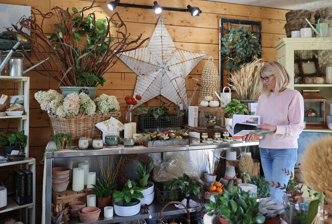 Residents of Centerville shop for unique gifts and seasonal plantings at Centerville Farm.