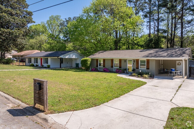 The mature neighborhoods of Panthersville are characterized by charming ranch-style homes, showcasing spacious front yards and inviting porches that reflect a sense of community and tranquility.