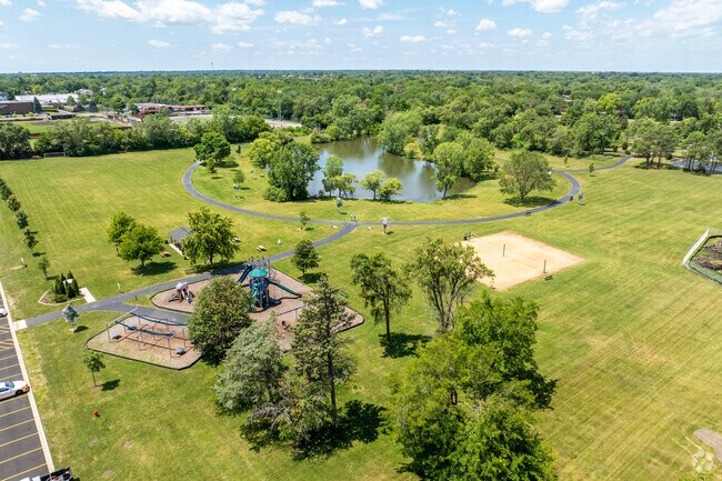 Yorktown residents enjoy a brisk morning walk at Knolls Park.