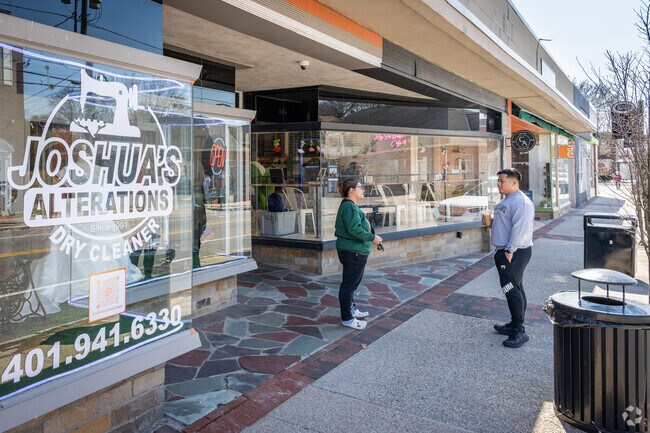 Chat with friends as you explore the small businesses in Rolfe Square, Eden Park, Cranston.