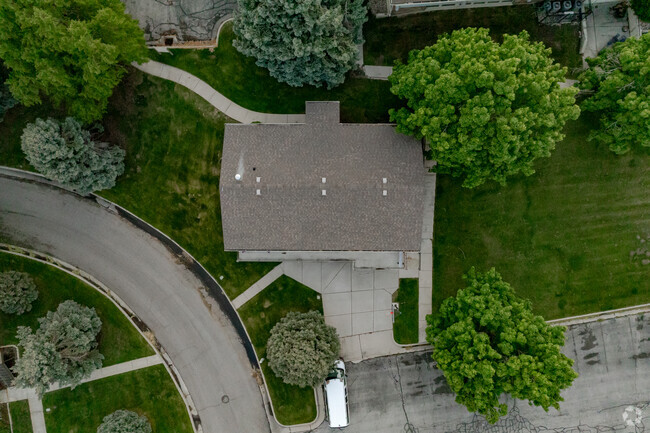 Realms of Inquiry is surrounded by well kept lawns and trees.