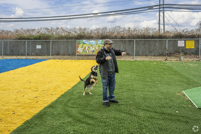 Let your pup run free at the members only dog park at the Valley Stream Village Green.
