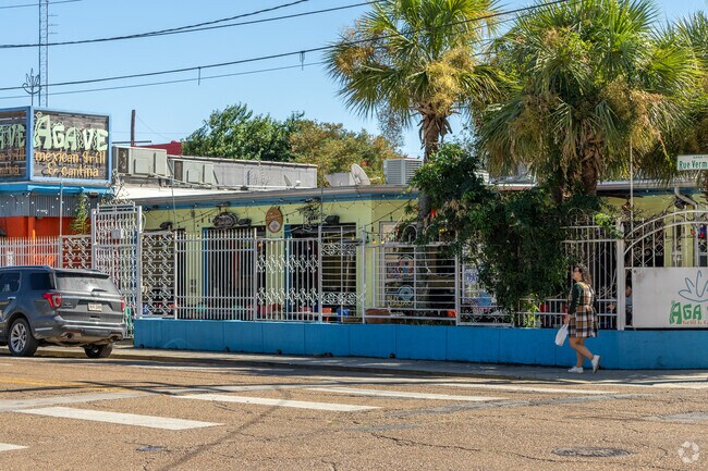 A curious young lady wonders the streets of Downtown Lafayette.