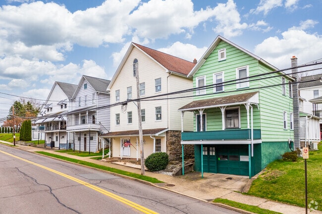 Colorful stick built homes line Main Street in Sugar Notch.