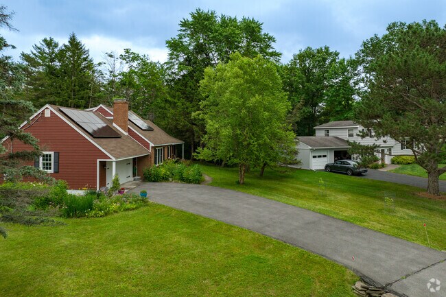 Most homes in Northeast Ithaca feature large front yards and asphalt driveways.