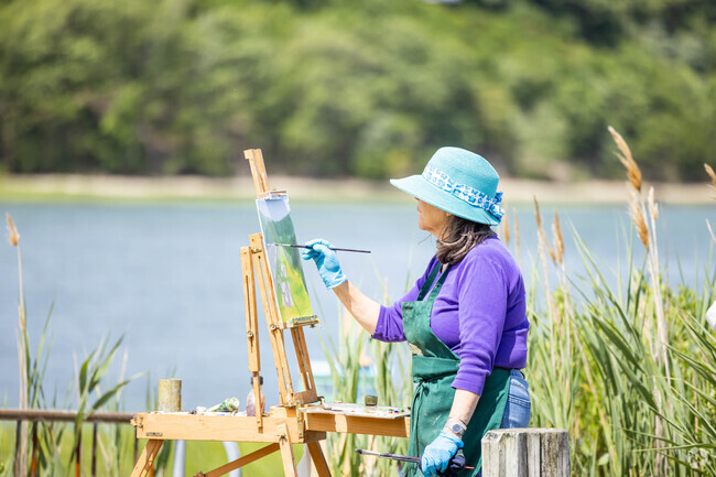 Locals paint the beautiful scenery at Satterly Landing in Mount Sinai.