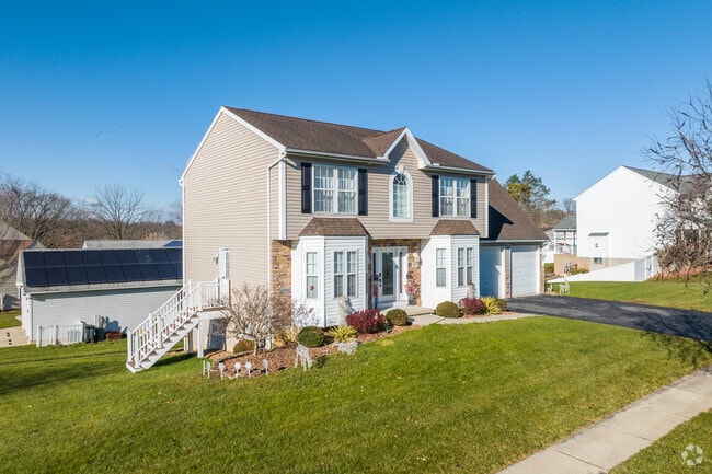 Modern Colonial homes in Stiles built in the early 2000s often include attached garages.