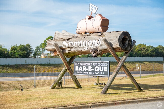 This oversized Sconyer's BBQ sign sits out by the highway for motorists to see.