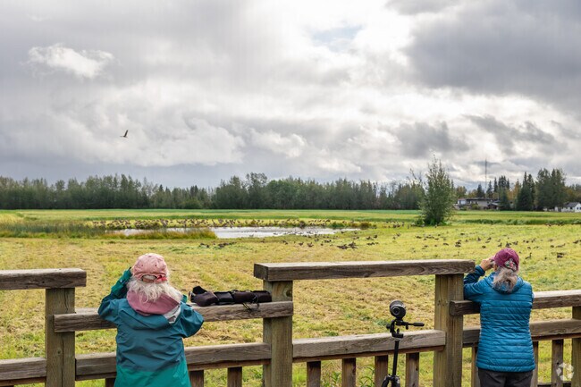 Bird enthusiasts enjoy watching the flocks at Creamer's Field in Fairbanks.