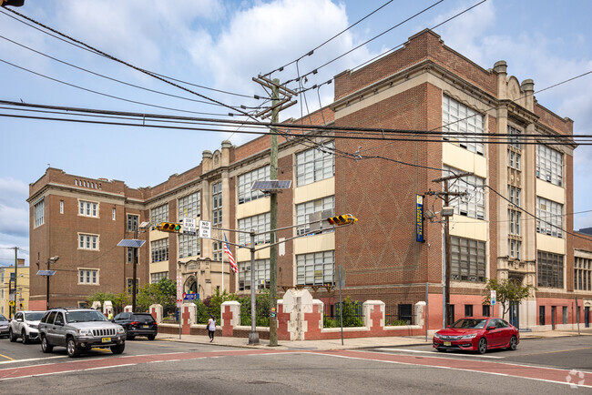 A full view of the Lafayette Street School, Newark, NJ can be seen from the other street.